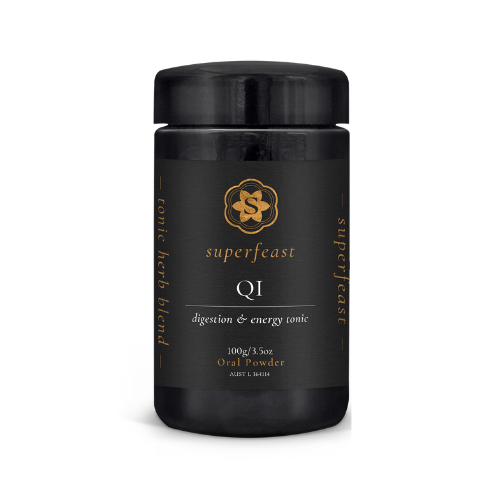 Black container of Superfeast QI tonic herb blend on a white background