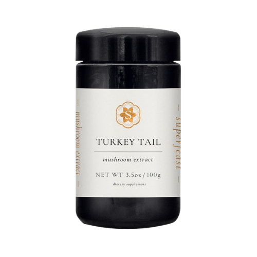 Jar of turkey tail mushroom extract on a white background
